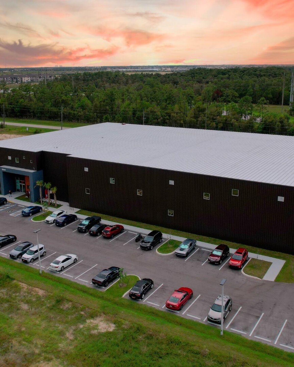 Aerial view of the AHT manufacturing facility in Fort Myers at sunset